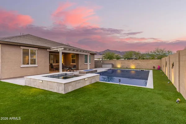 a view of a chairs and table in the patio
