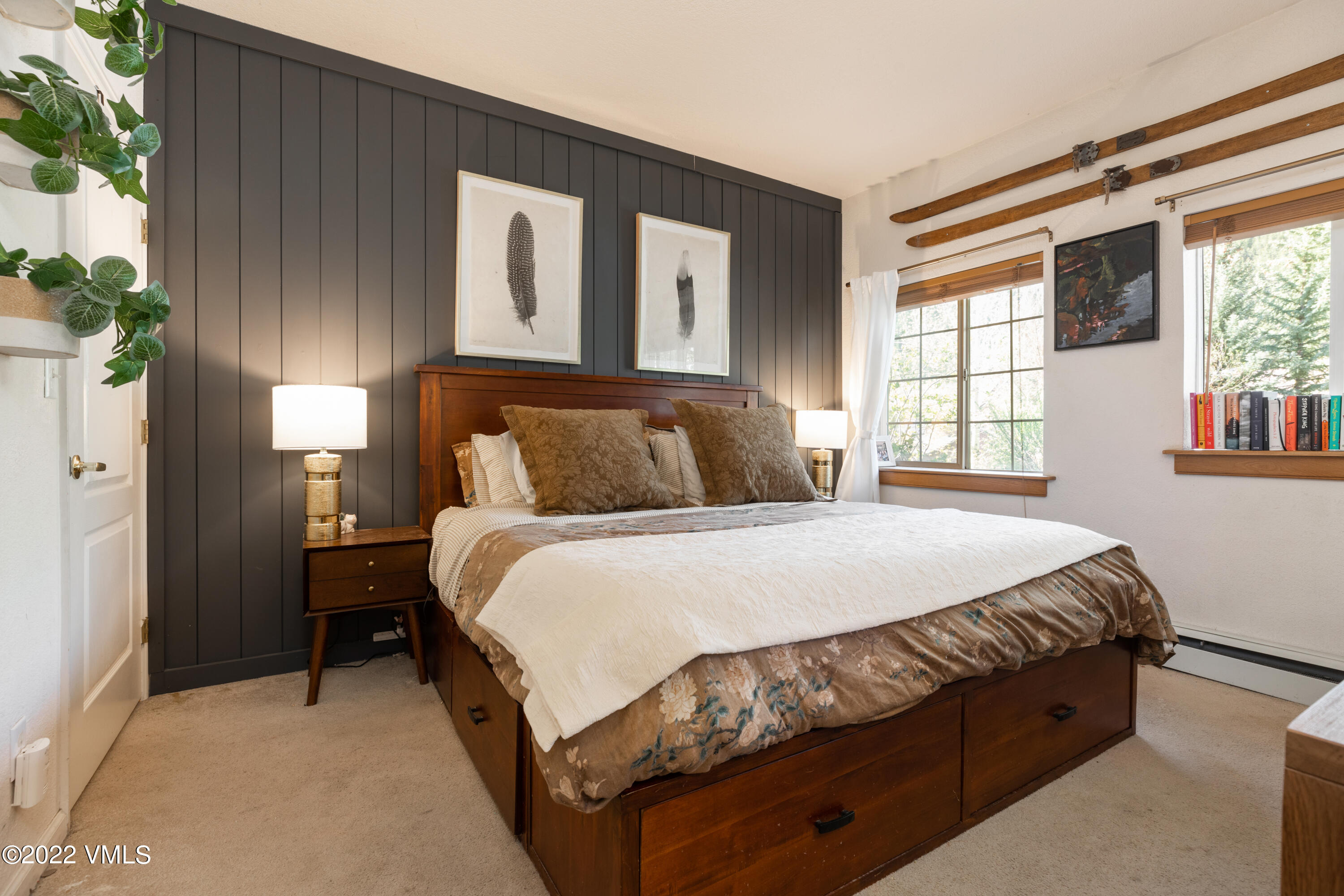 175 Hurd Lane, Unit 3101 Avon, CO 81620 - Photo 4 of 7 a bedroom with a bed lamp and a window