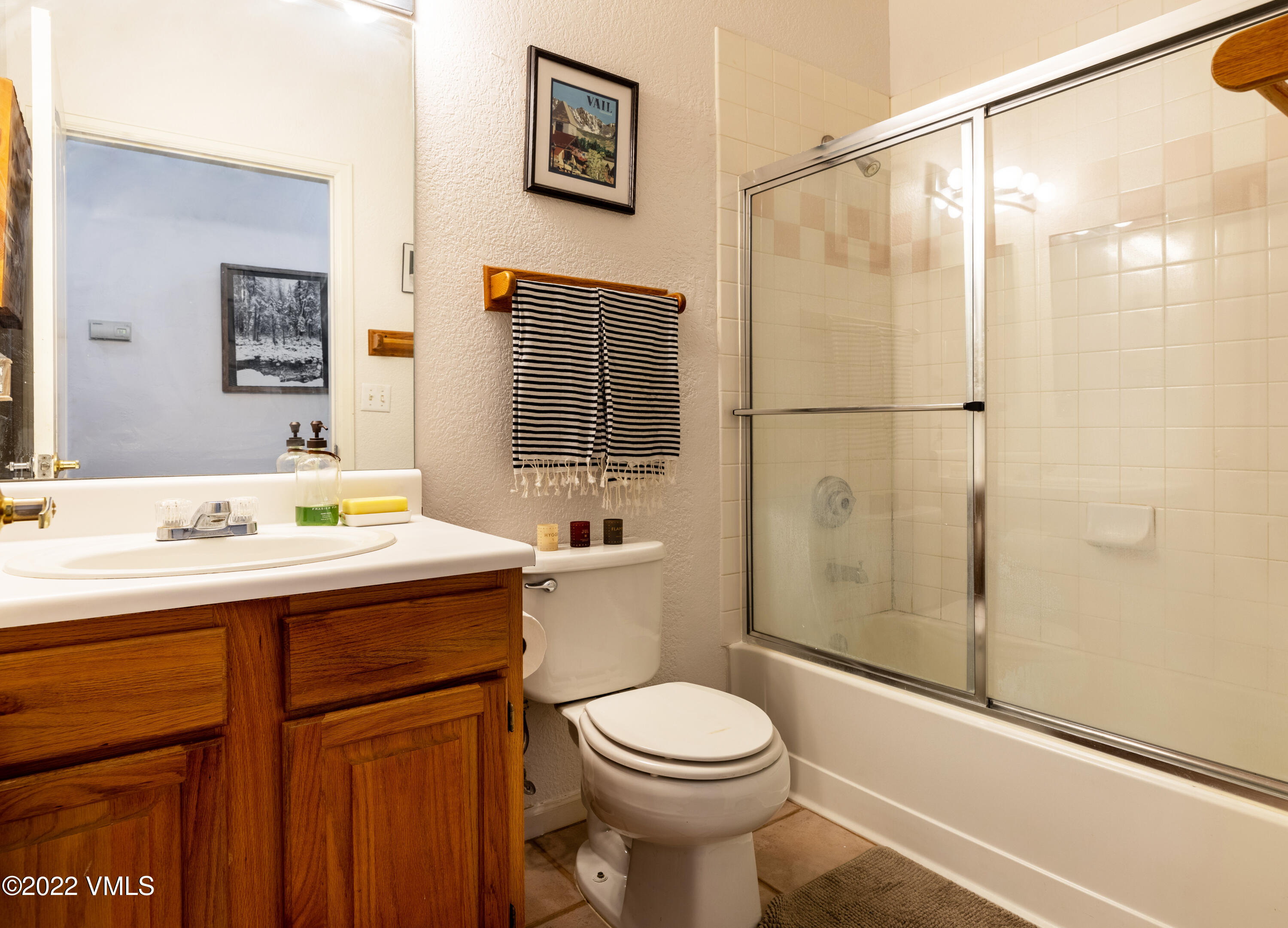 175 Hurd Lane, Unit 3101 Avon, CO 81620 - Photo 6 of 7 a bathroom with a sink a toilet and shower