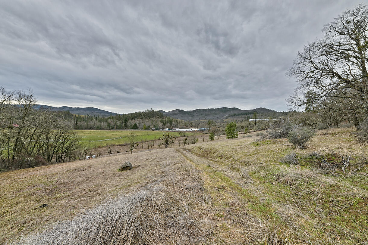 13546 Highway 140 Eagle Point, OR 97524 - Photo 4 of 24 a view of lake with mountain in background