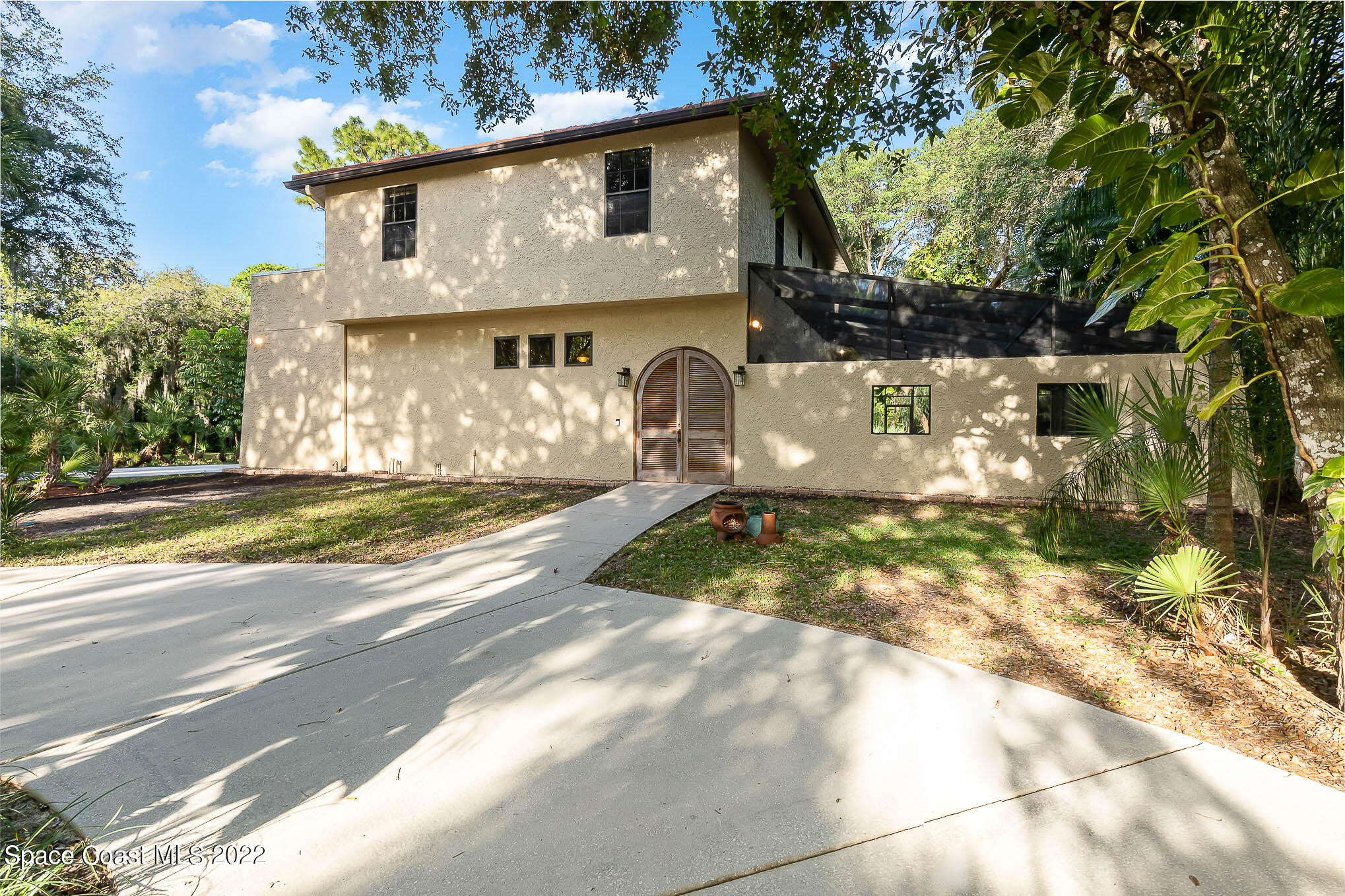 3225 Turtle Mound Road Melbourne, FL 32934 - Photo 3 of 38 a view of a house with a yard