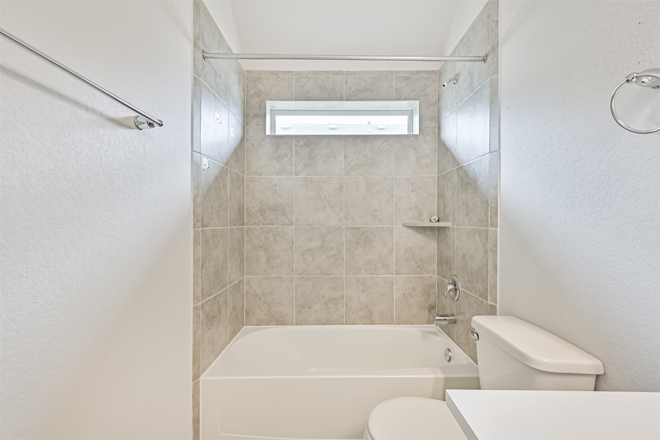 7019 Terra Drive Manvel, TX 77578 - Photo 29 of 41 a bathroom with a bathtub and a shower