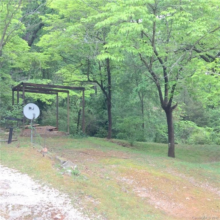 59 Beaver Street Tryon, NC 28782 - Photo 2 of 14 a backyard of a house with barbeque oven