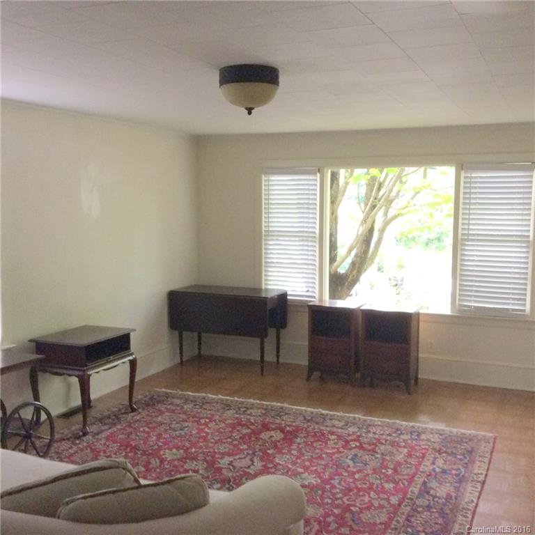 59 Beaver Street Tryon, NC 28782 - Photo 5 of 14 a living room with furniture and a window