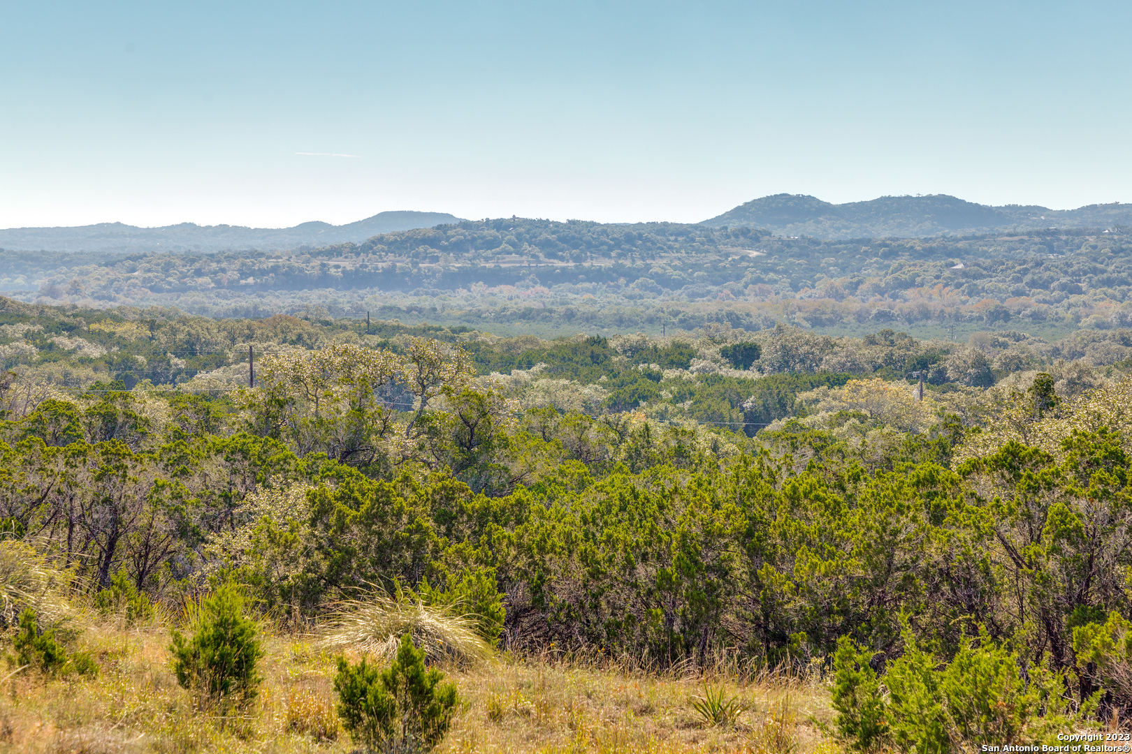 10205 2 Johns Road Boerne, TX 78006 - Photo 15 of 32 a view of a mountain in the distance in a field