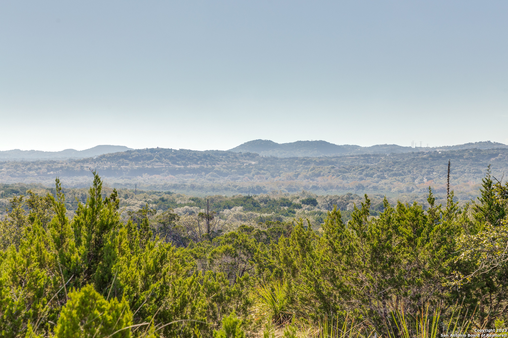 10205 2 Johns Road Boerne, TX 78006 - Photo 16 of 32 a view of a lush green field with mountains in the background