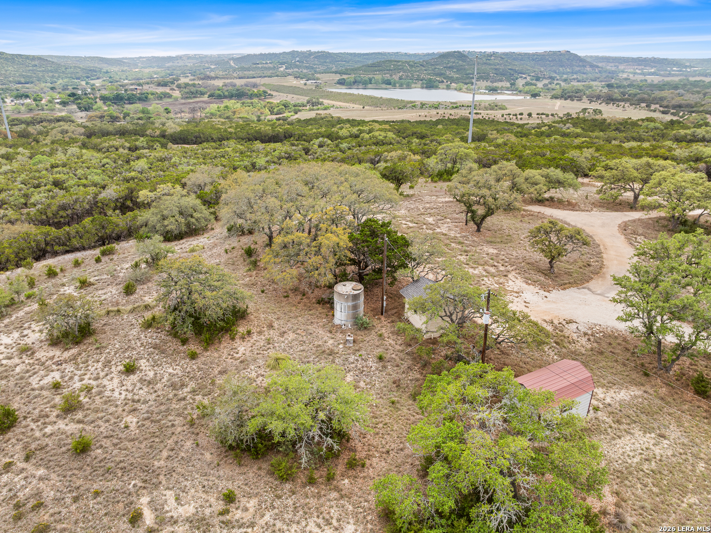10205 2 Johns Road Boerne, TX 78006 - Photo 24 of 32 a view of a lake with mountains in the background