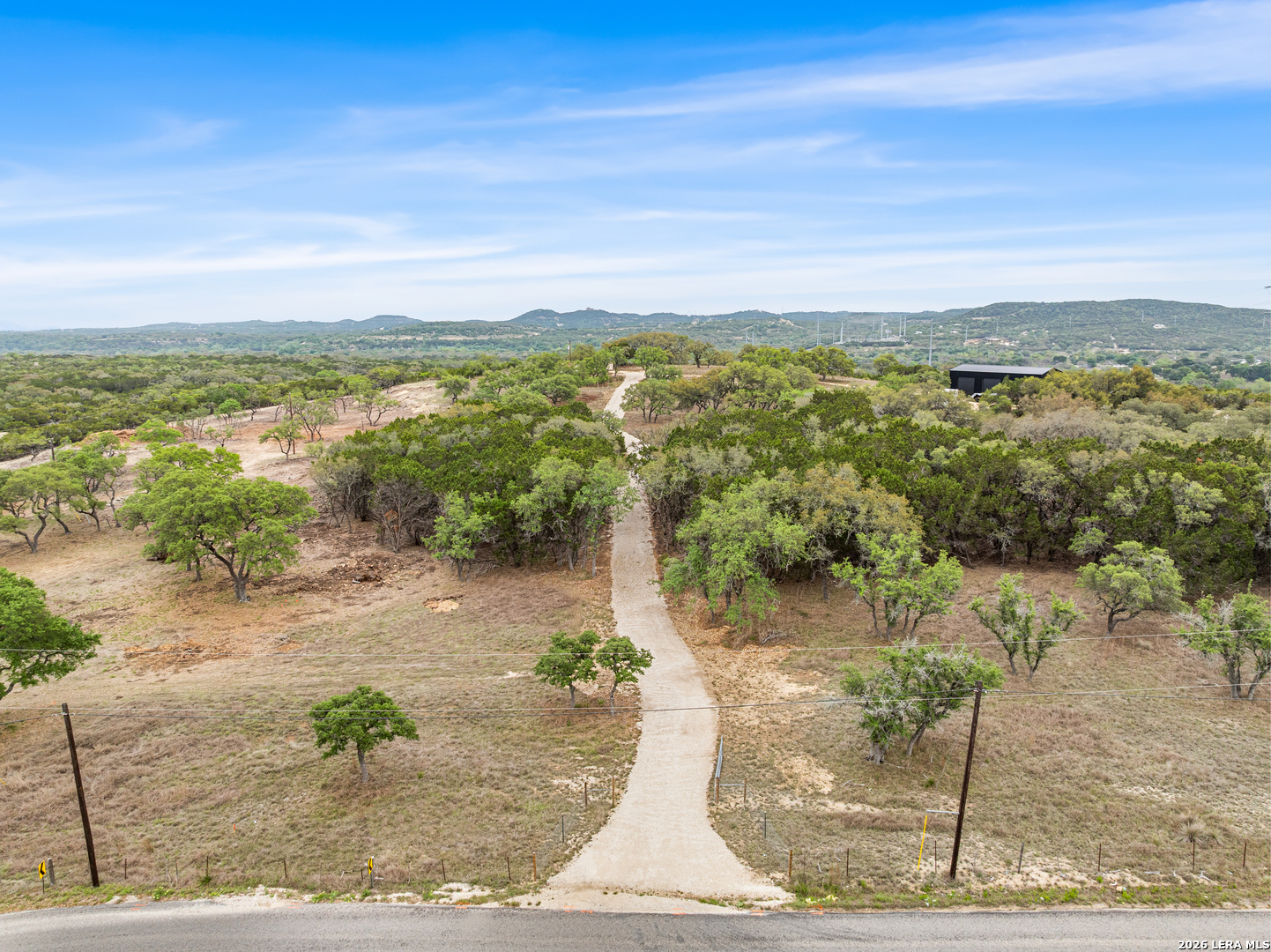 10205 2 Johns Road Boerne, TX 78006 - Photo 32 of 32 a view of a lake with beach