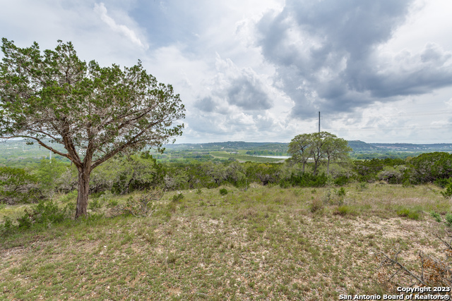 10205 2 Johns Road Boerne, TX 78006 - Photo 10 of 32 a view of a lake with mountains in the background