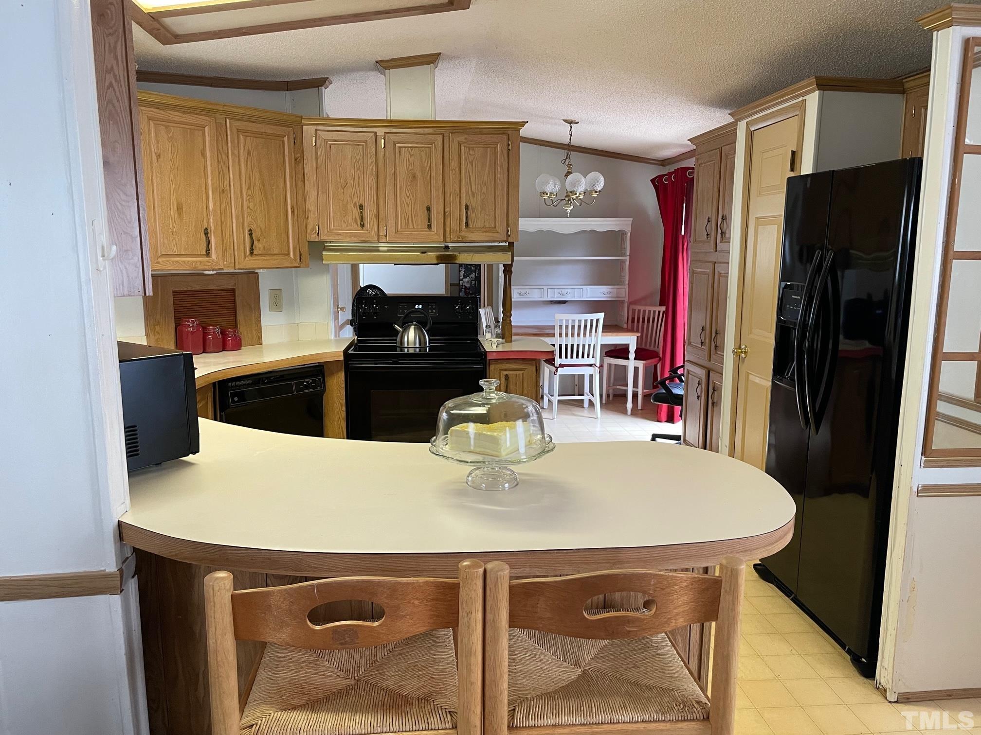 1616 Pope Road Creedmoor, NC 27522 - Photo 10 of 42 a kitchen with a table and chairs