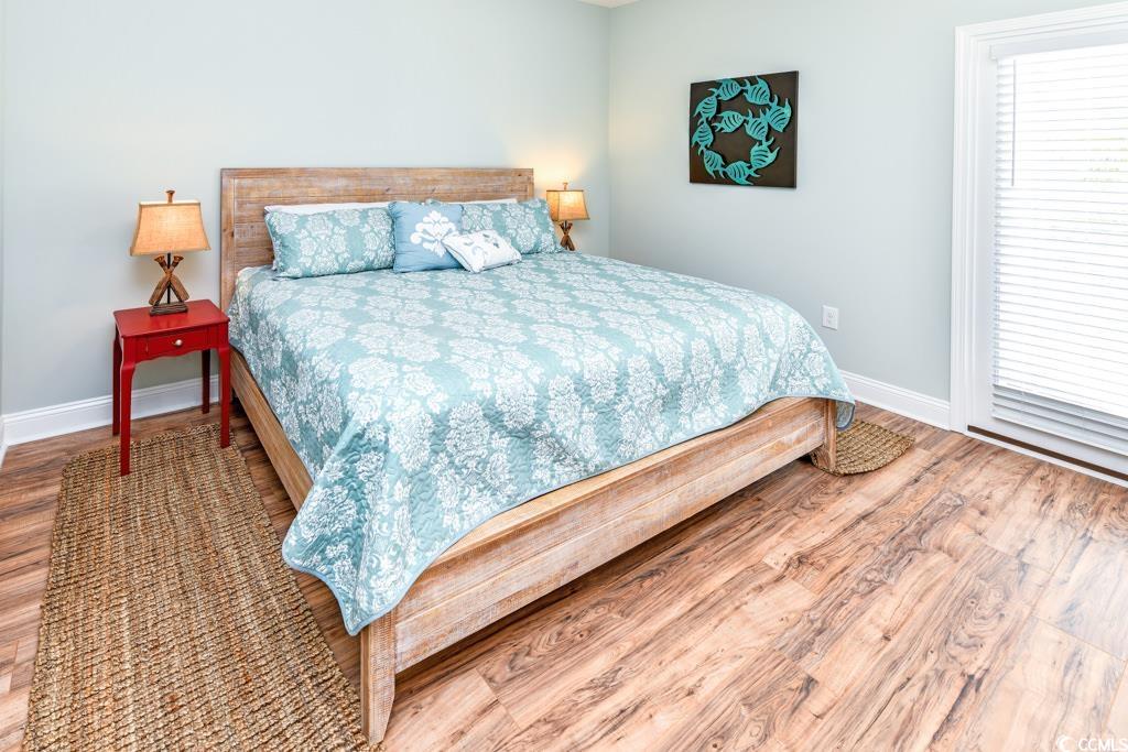 1614 North Ocean Boulevard Surfside Beach, SC 29575 - Photo 11 of 38 Bedroom with wood finished floors and baseboards