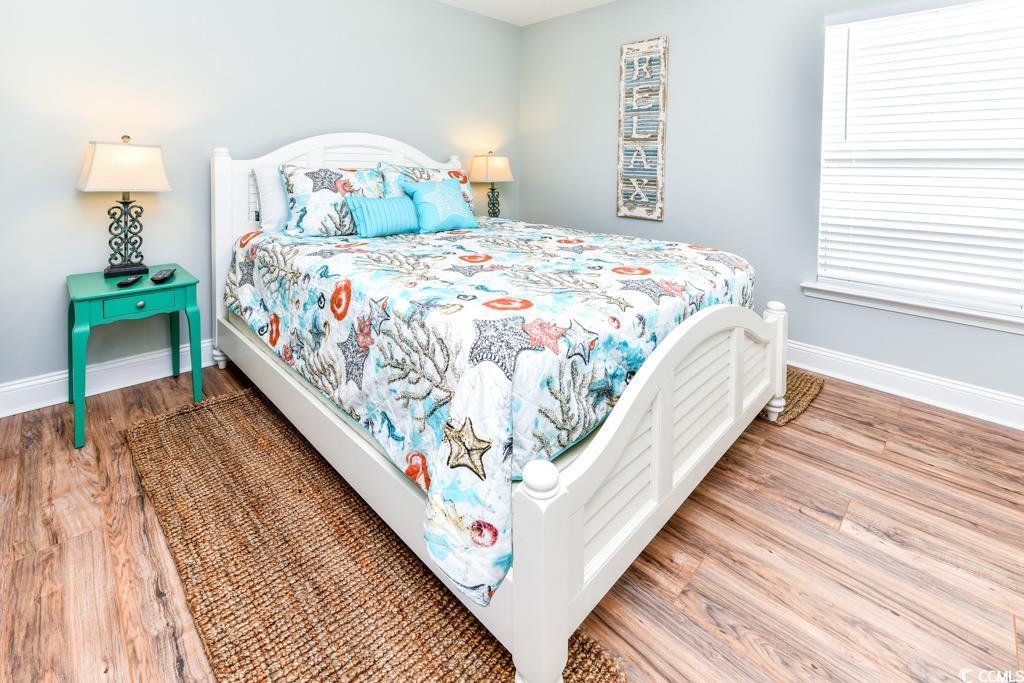 1614 North Ocean Boulevard Surfside Beach, SC 29575 - Photo 20 of 38 Bedroom with wood finished floors and baseboards