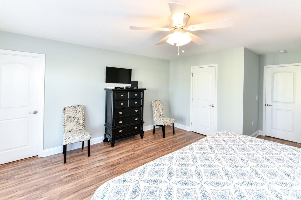 1614 North Ocean Boulevard Surfside Beach, SC 29575 - Photo 29 of 38 Bedroom featuring ceiling fan, baseboards, and wood finished floors