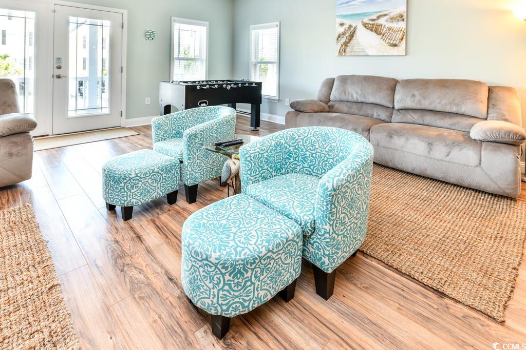 1614 North Ocean Boulevard Surfside Beach, SC 29575 - Photo 6 of 38 Living area with french doors, baseboards, and wood finished floors