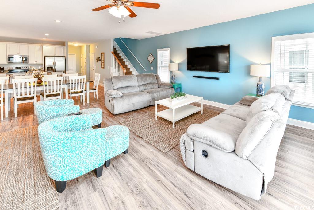 1614 North Ocean Boulevard Surfside Beach, SC 29575 - Photo 7 of 38 Living area with light wood finished floors, ceiling fan, baseboards, stairway, and recessed lighting