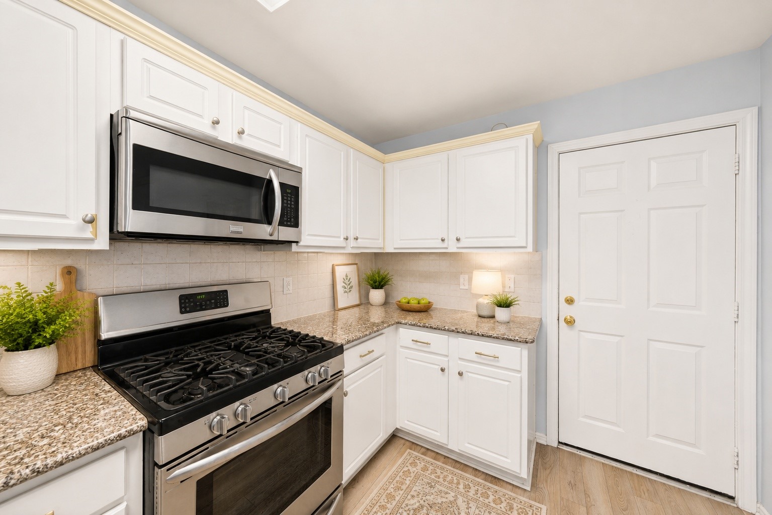 38 Musgrove Place Spring, TX 77382 - Photo 9 of 36 Bright kitchen with crisp white cabinetry, granite countertops, tile backsplash, and generous prep space.