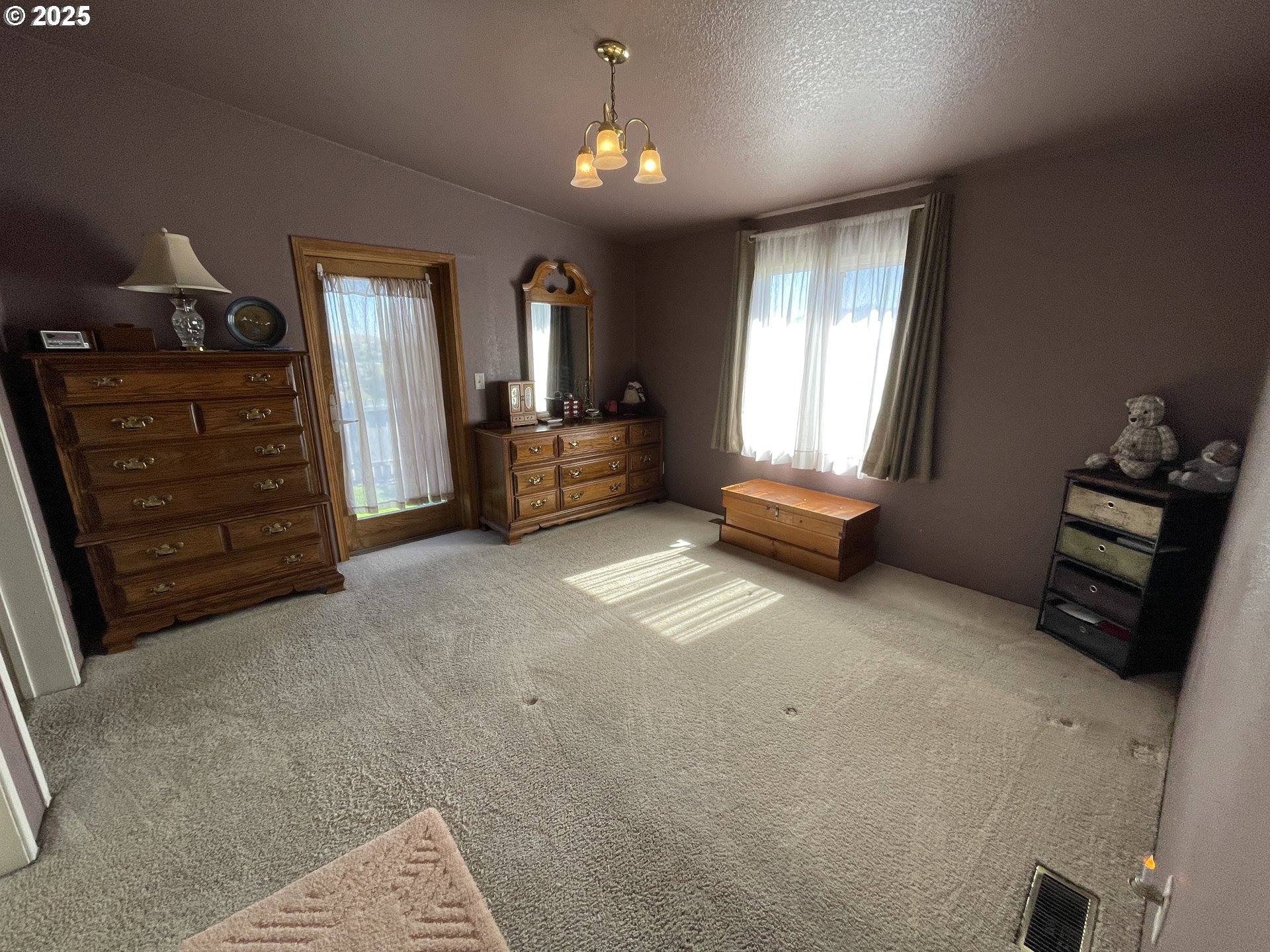 203 Court Street Enterprise, OR 97828 - Photo 14 of 23 a bedroom with furniture and window