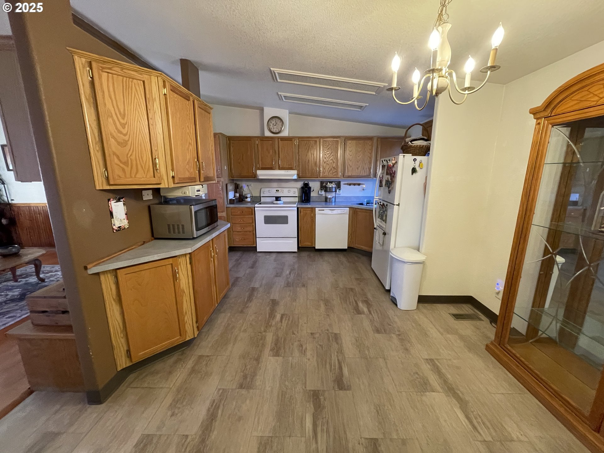 203 Court Street Enterprise, OR 97828 - Photo 18 of 23 a kitchen with sink refrigerator and window