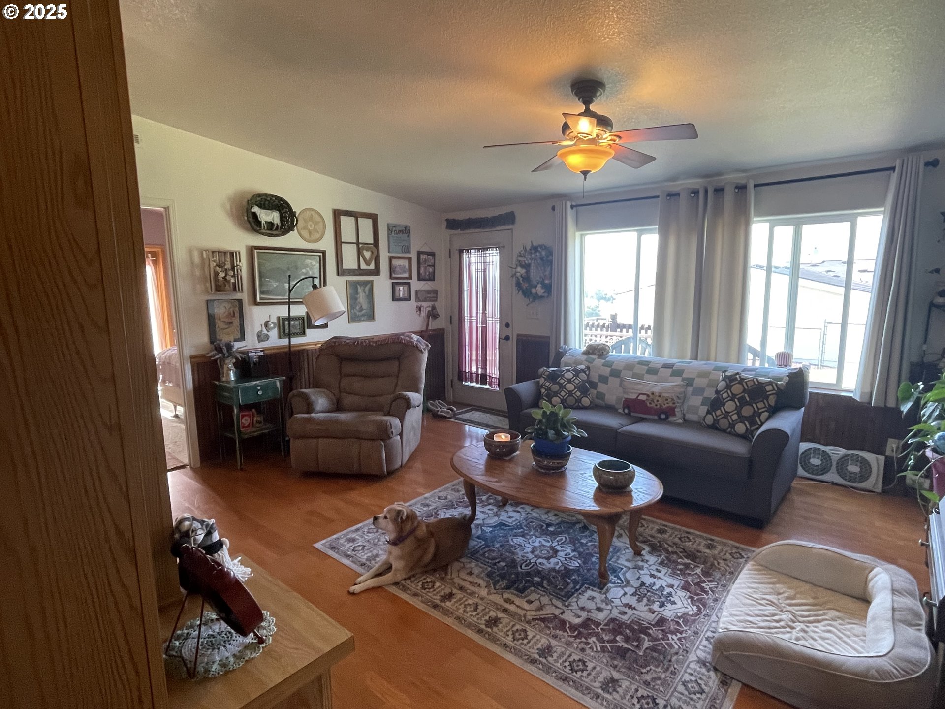 203 Court Street Enterprise, OR 97828 - Photo 7 of 23 a living room with furniture and a chandelier