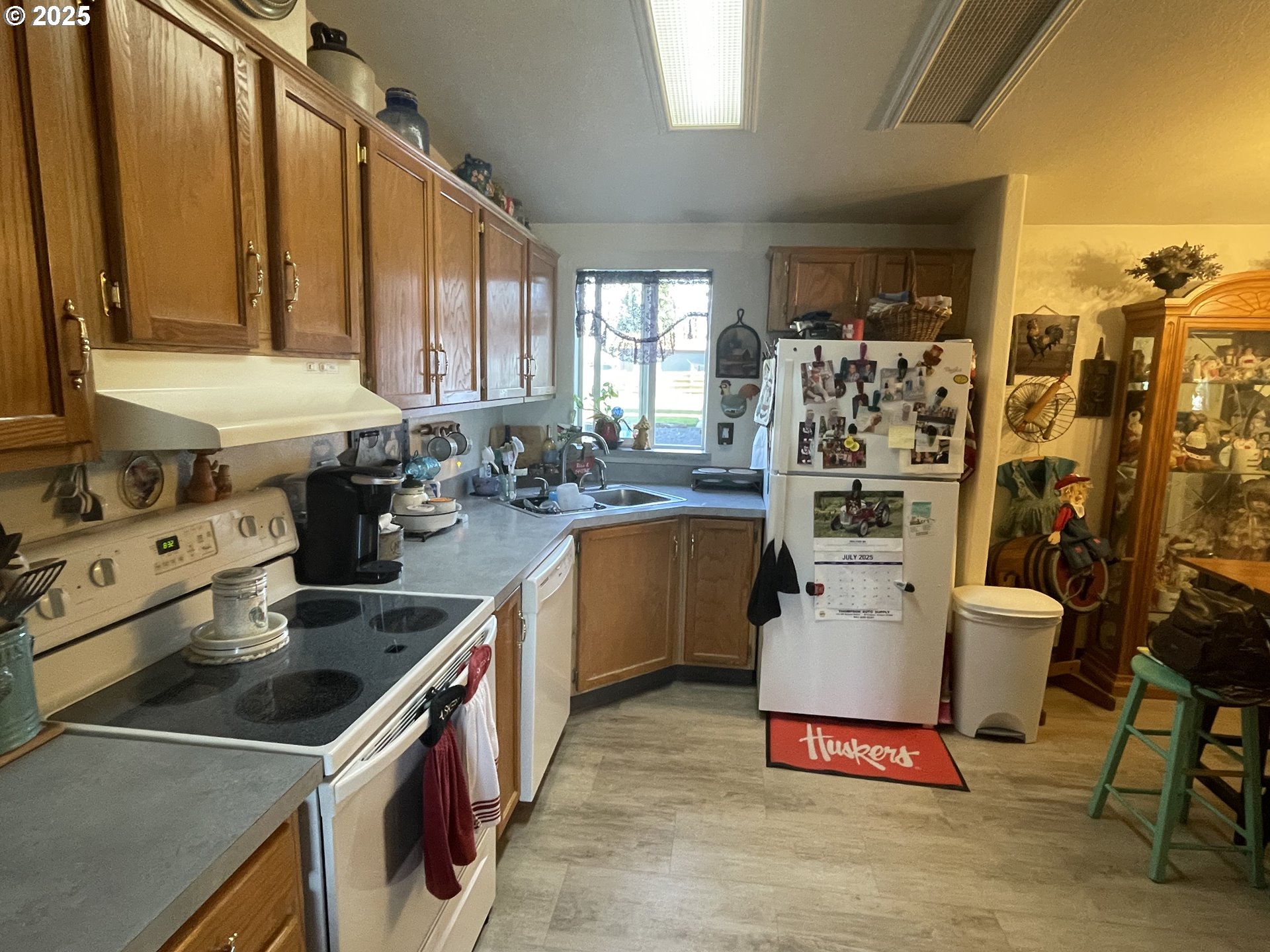 203 Court Street Enterprise, OR 97828 - Photo 9 of 23 a kitchen with a sink stove and cabinets