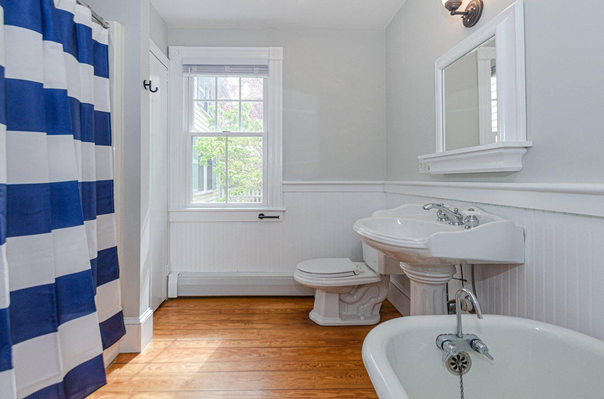 1089 Main Street Cotuit, MA 02635 - Photo 16 of 41 a bathroom with a sink and a mirror