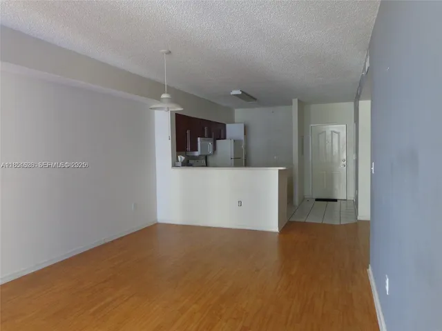 a view of a kitchen with a sink and cabinet area