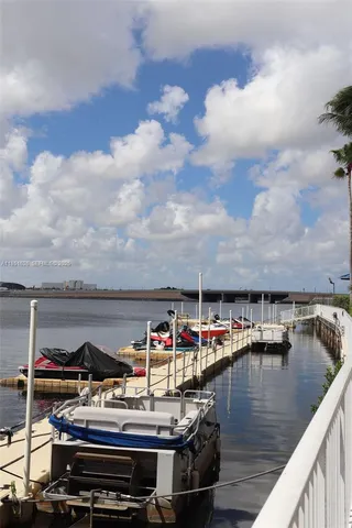 a view of house with lake and sitting space