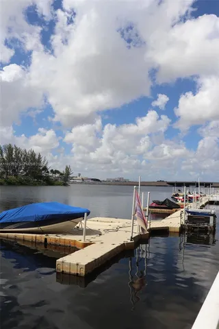 a view of swimming pool with furniture