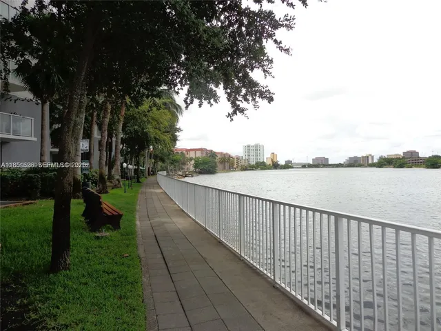 a view of a street with a lake view
