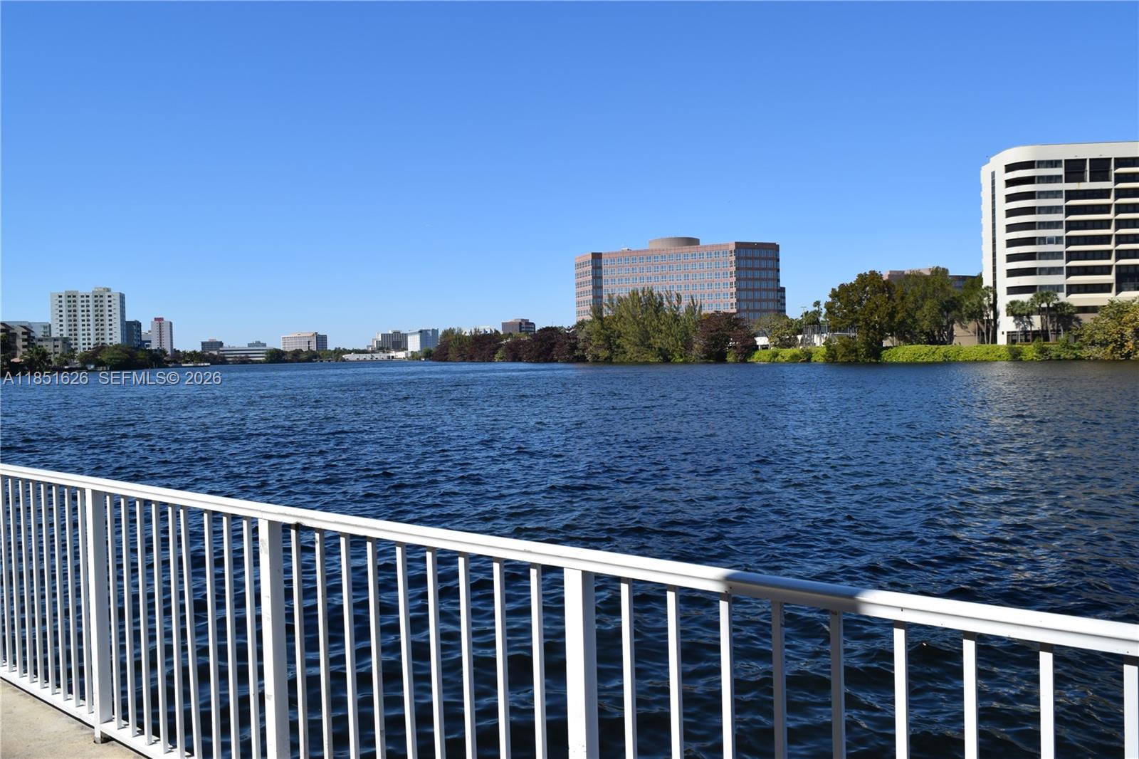 5091 Northwest 7th Street, Unit 711 Miami, FL 33126 - Photo 28 of 72 a view of a balcony with wooden floor