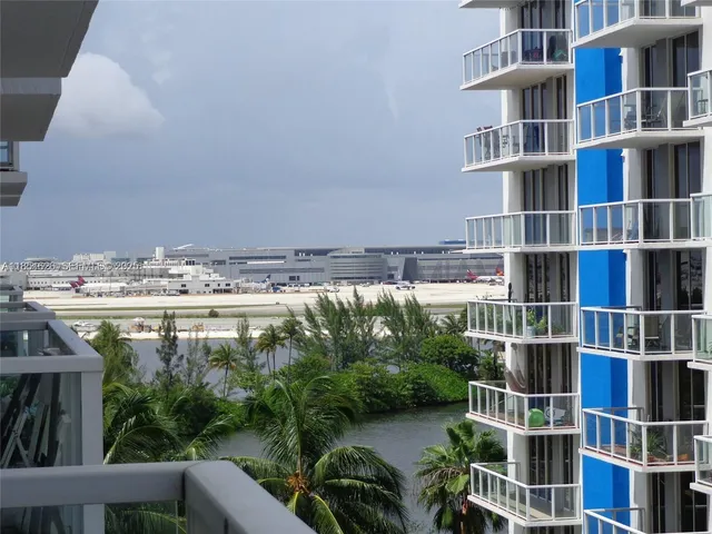 a view of swimming pool with outdoor seating and plants