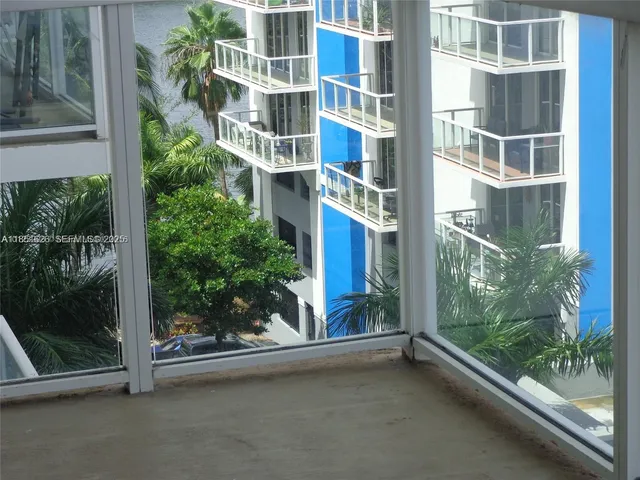a view of a balcony with a tree