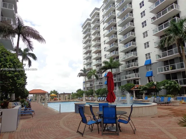 a table and chairs sitting in front of a building