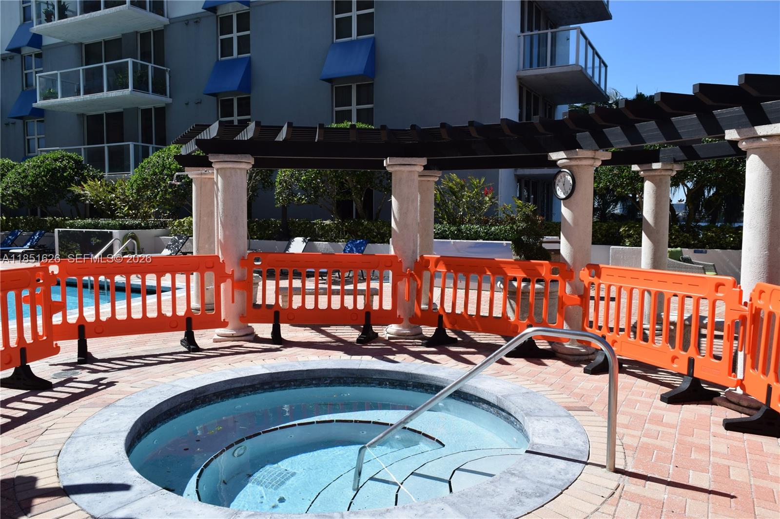 5091 Northwest 7th Street, Unit 711 Miami, FL 33126 - Photo 55 of 72 a view of a chairs and tables in the patio