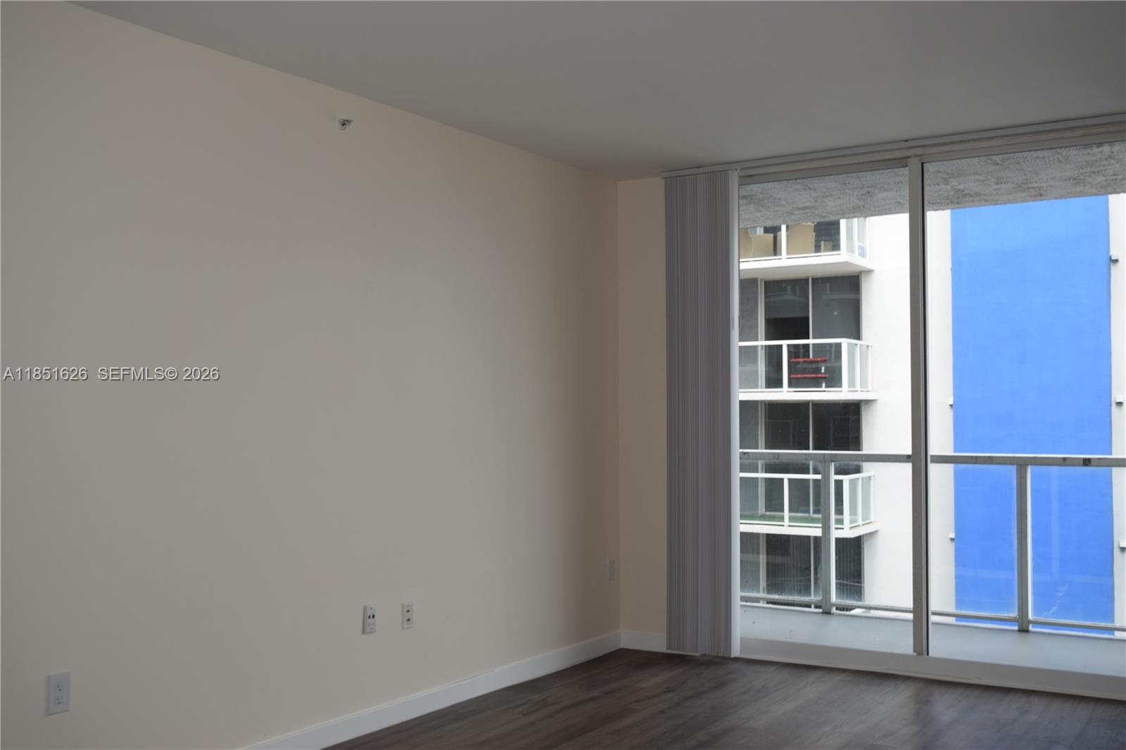 5091 Northwest 7th Street, Unit 711 Miami, FL 33126 - Photo 63 of 72 a view of wooden floor and windows in a room