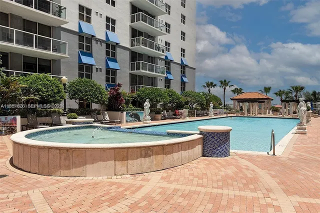 a view of a swimming pool with a patio