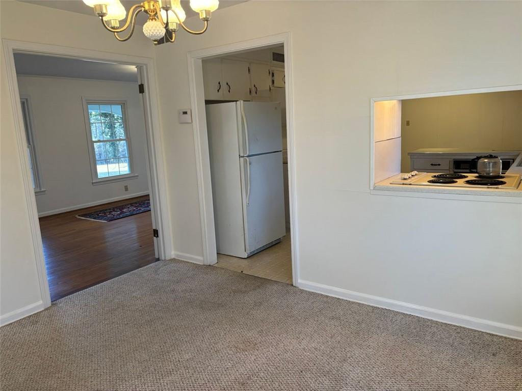 814 Shannon Circle Northeast Rome, GA 30161 - Photo 13 of 47 a view of a kitchen with a refrigerator and cabinet