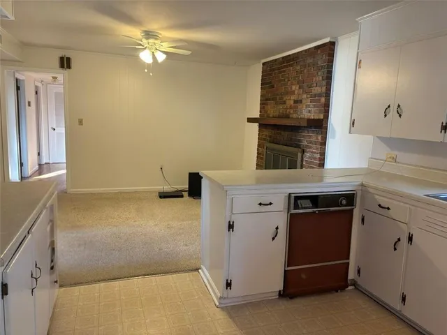 a kitchen with a sink and a window