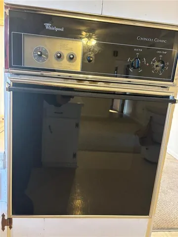 a open kitchen with cabinets and a fireplace