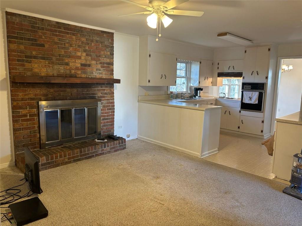 814 Shannon Circle Northeast Rome, GA 30161 - Photo 23 of 47 a open kitchen with cabinets and a fireplace