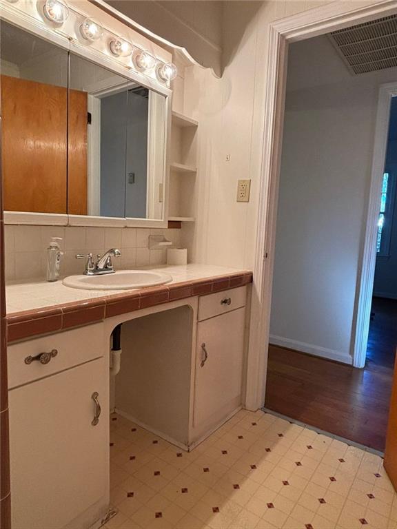 814 Shannon Circle Northeast Rome, GA 30161 - Photo 27 of 47 a bathroom with a sink a toilet and mirror