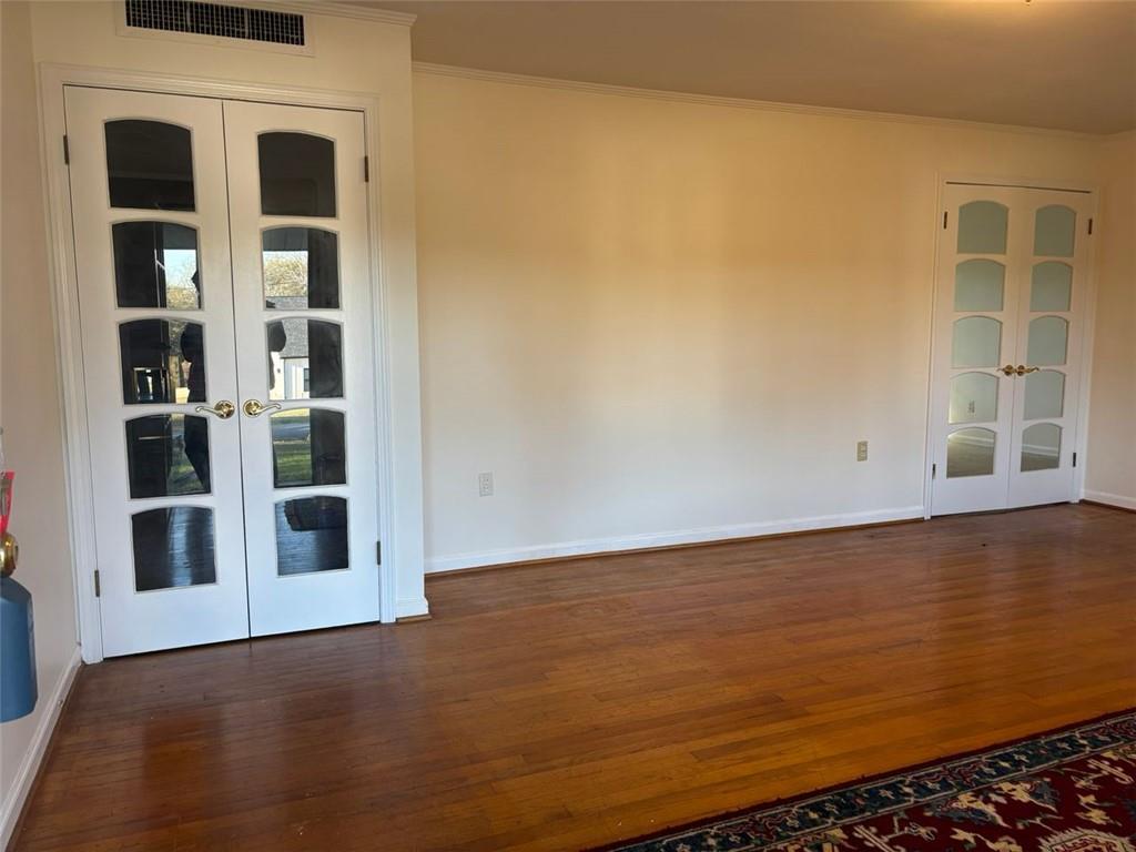 814 Shannon Circle Northeast Rome, GA 30161 - Photo 4 of 47 a view of an empty room with wooden floor and a window