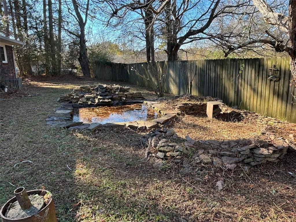 814 Shannon Circle Northeast Rome, GA 30161 - Photo 43 of 47 a view of a yard with plants and a bench