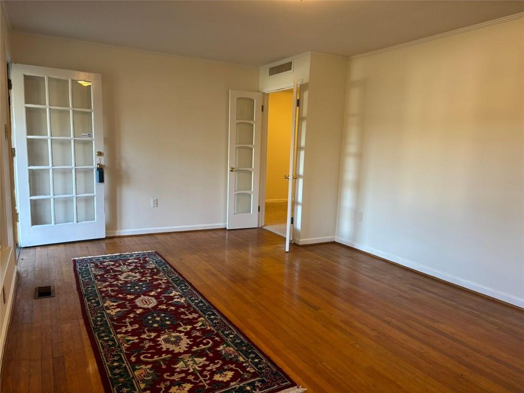 814 Shannon Circle Northeast Rome, GA 30161 - Photo 5 of 47 an empty room with wooden floor and window