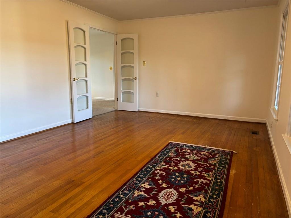 814 Shannon Circle Northeast Rome, GA 30161 - Photo 6 of 47 wooden floor in a hall with an empty room