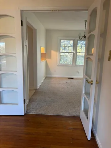 a view of livingroom with hardwood floor and window