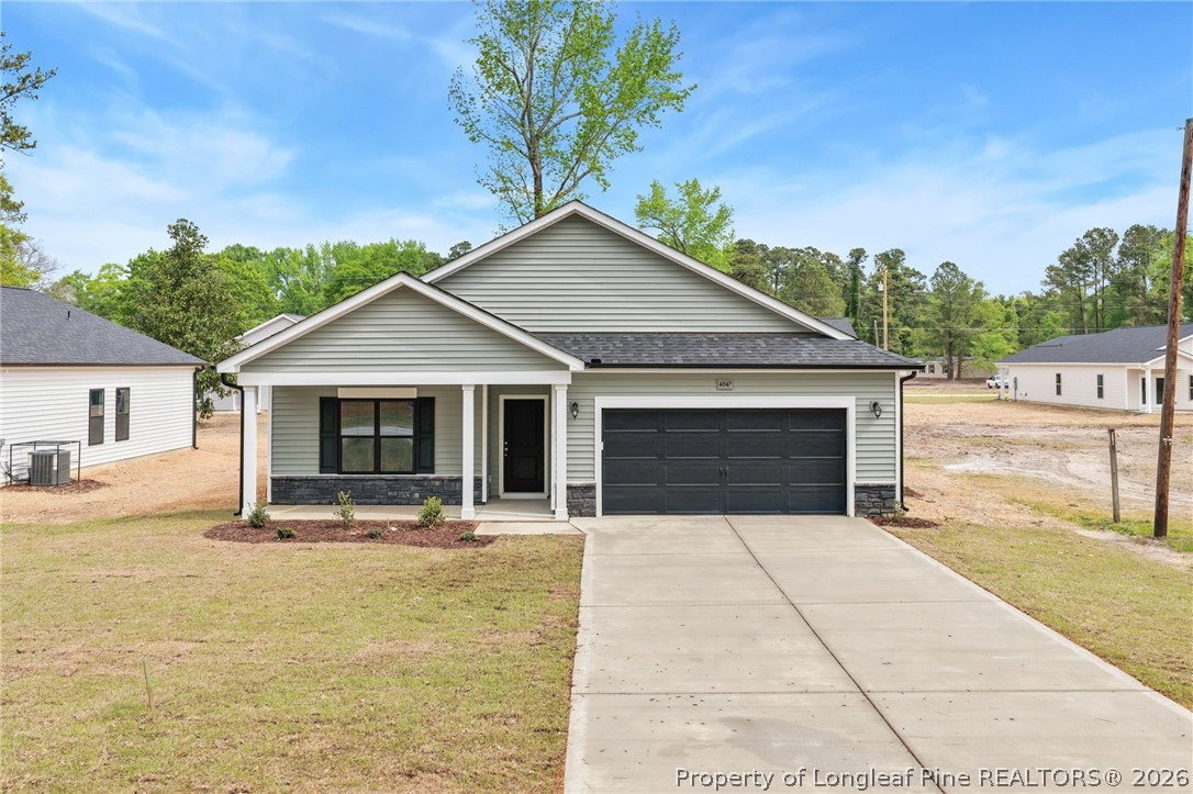 4047 Church Street Wade, NC 28395 - Photo 1 of 30 a front view of a house with yard and green space