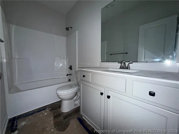 a room that has a sink and a mirror