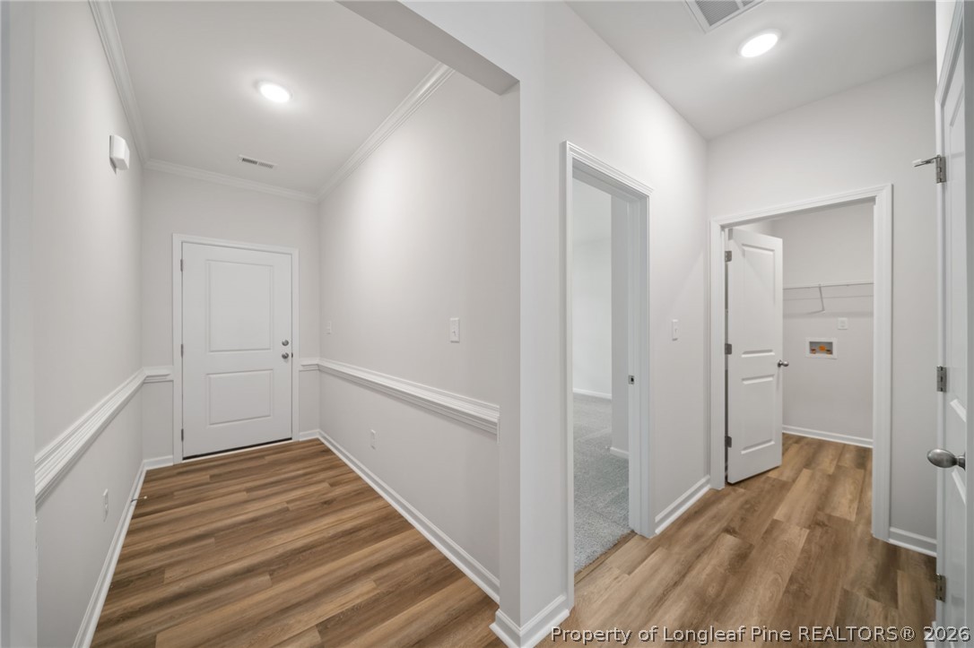 4047 Church Street Wade, NC 28395 - Photo 14 of 30 a view of a hallway with wooden floor and entryway