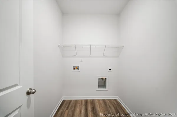 a bathroom with a toilet a sink a mirror a bathtub and vanity